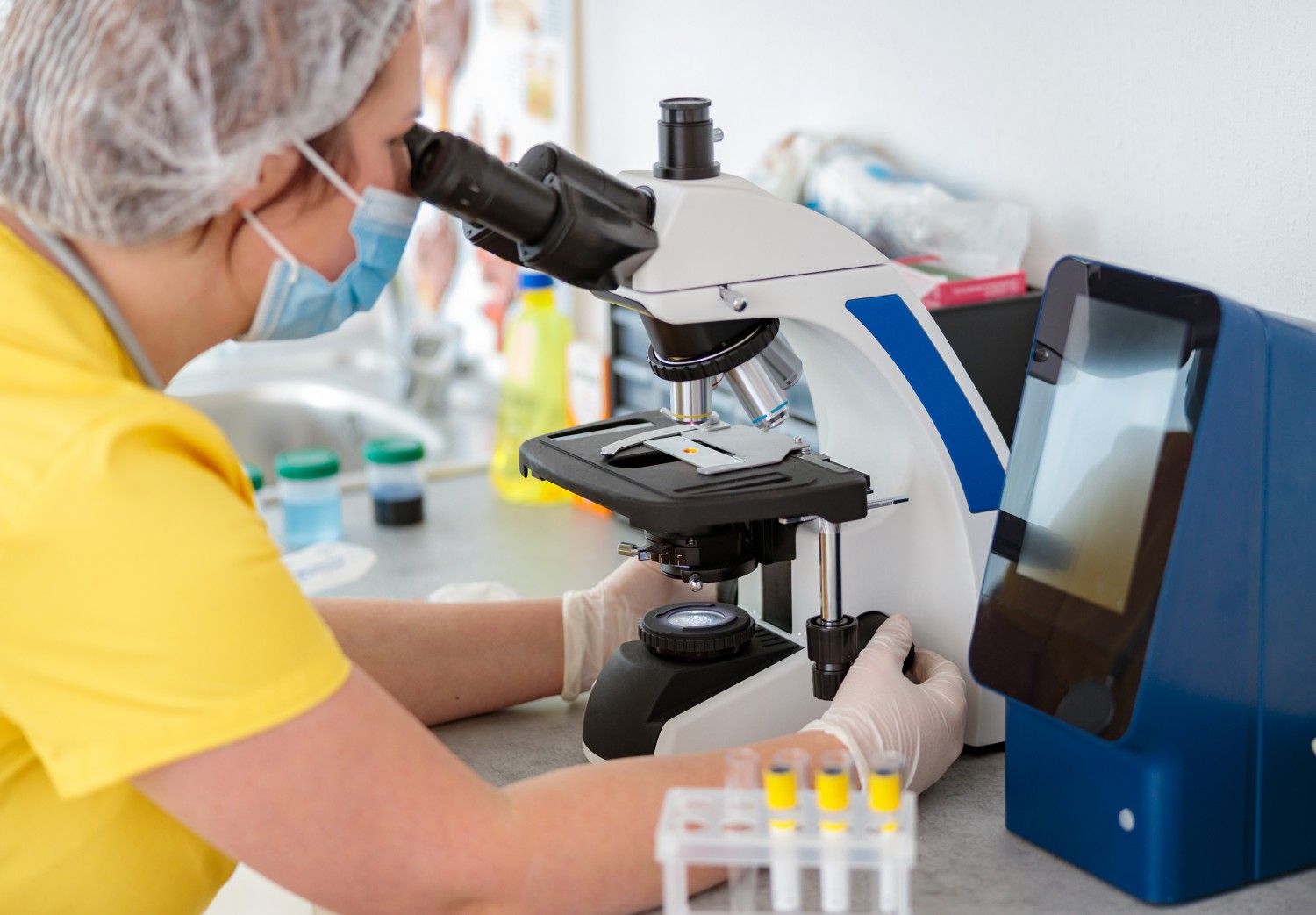 Staff performing laboratory test Staff performing laboratory test